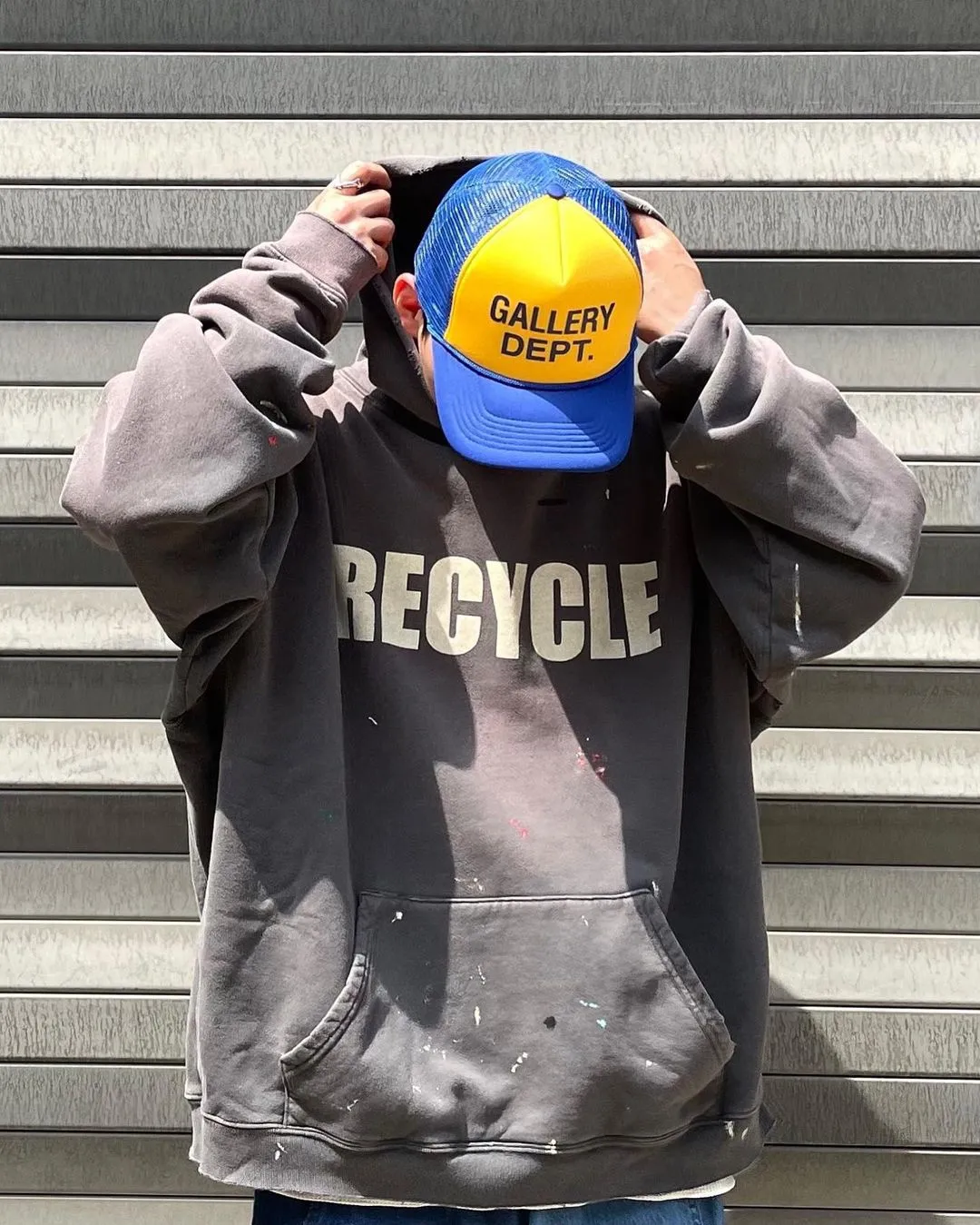 GALLERY DEPT. 90'S RECYCLE HOODIE WASHED BLACK 90'S washed hoodie with distressed eco-friendly slogans. Washed black S-XL. Ready-made garments are washed and dyed again. Multiple spots throughout the body are spray-faded. The ribs are cut and worn.